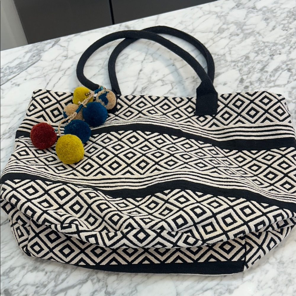 Chic Black and White Tote with Colorful Pom Poms